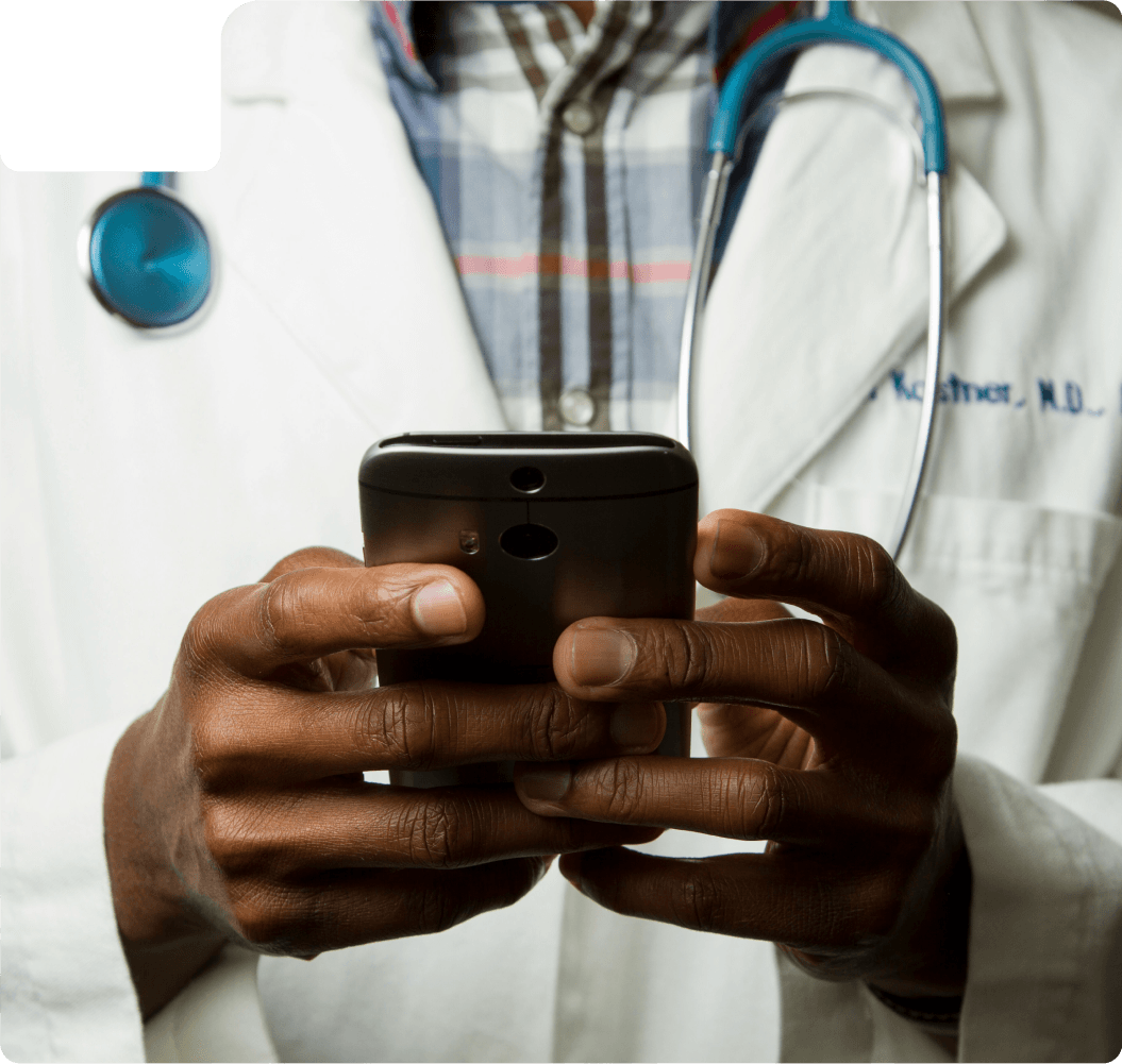 A doctor holding a phone